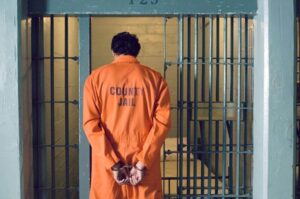 Prisoner at jail with handcuff.