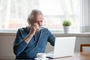 A man is searching for sex on his computer.