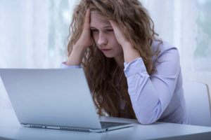 A woman committing sex crimes on her laptop.