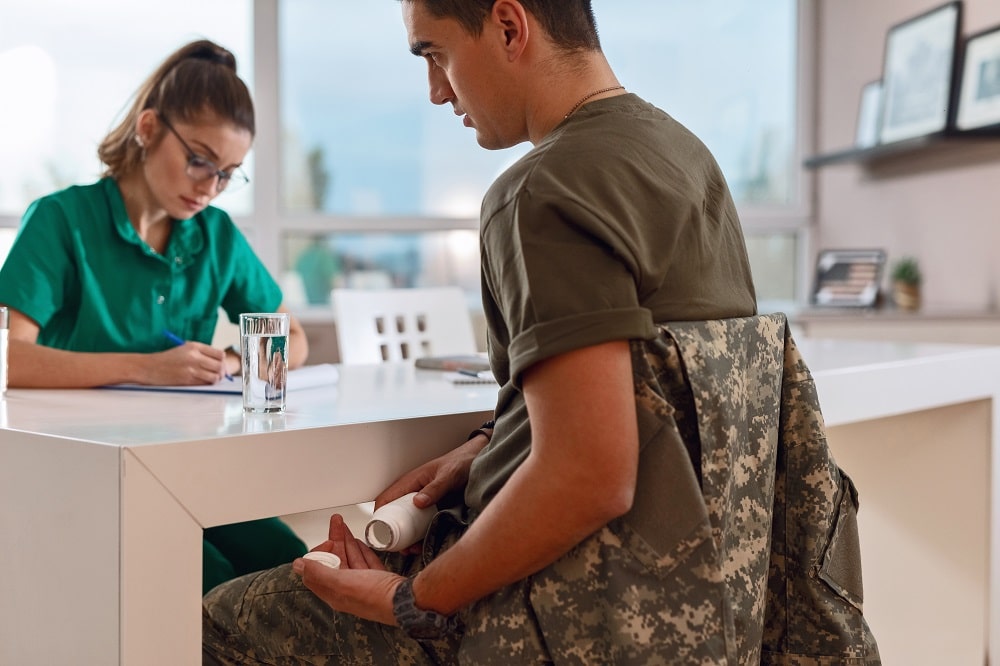 a man taking drugs at his doctors office