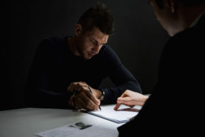 Person signing a document with attorney