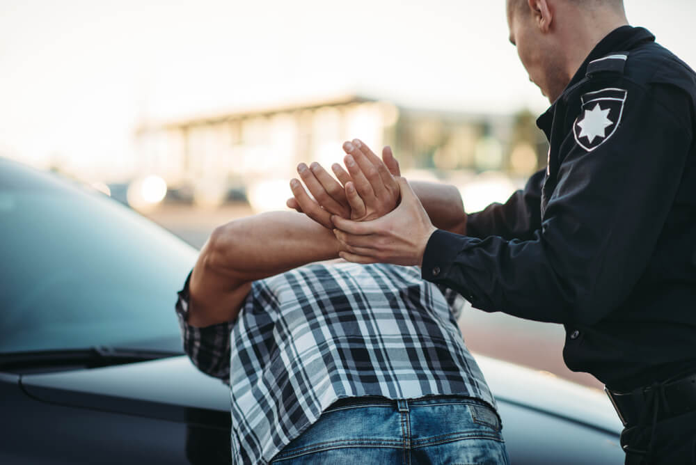 Police officer arresting a criminal