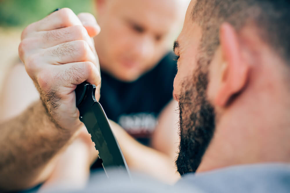 Man attacking the passerby with a knife.