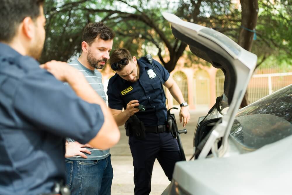 Police searching illegal items in the car.